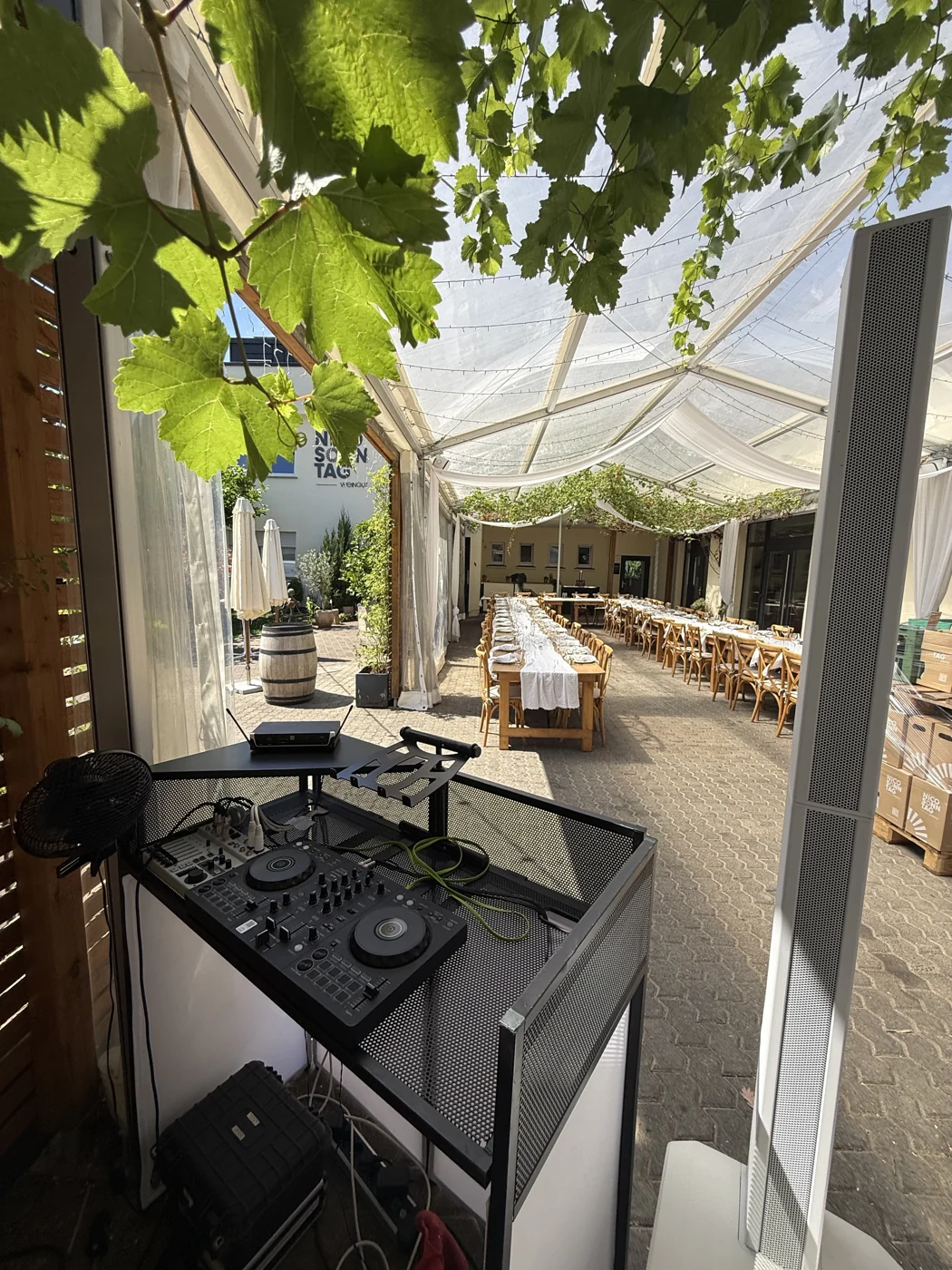 White DJ setup and dinner area at Weingut Nico Sonntag in Nittel